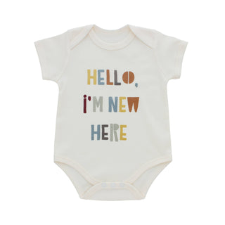 Hello, I’m new here onesie in 3-6 months with vintage font. Generous fit.