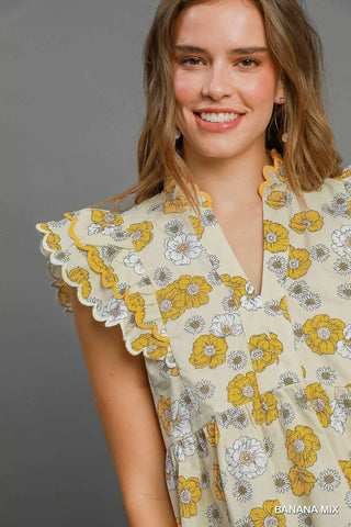 Floral print peplum top with scalloped sleeves and lined cotton fabric for women | JSQ Mercantile – a women’s boutique and gift shop in La Grange, IL.