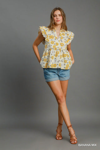 Floral print peplum top with scalloped sleeves and lined cotton fabric for women | JSQ Mercantile – a women’s boutique and gift shop in La Grange, IL.