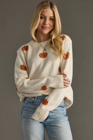 Cream Pumpkin Knit Sweater with pumpkin designs front & back. Relaxed fit, runs large, 100% acrylic. Shop JSQ Mercantile in La Grange, IL.