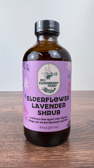 Elderflower Lavender Shrub in 8 oz glass bottle with organic elderflower, lavender, lemon and raw apple cider vinegar blend – JSQ Mercantile – a women’s boutique and gift shop in La Grange, IL.