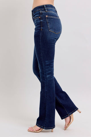 Blue jeans worn by a person on a white background