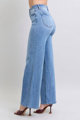 Light blue wide-leg jeans worn by a person on a plain background - JSQ Mercantile in La Grange IL