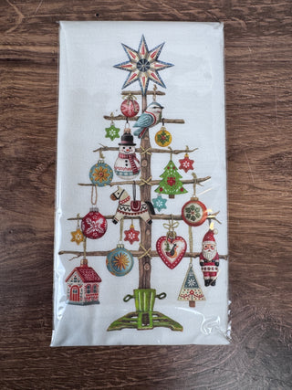 Nordic Ornament Christmas Tree cotton tea towel in red and white, displayed folded on a countertop – JSQ Mercantile – a women’s boutique and gift shop in La Grange, IL.