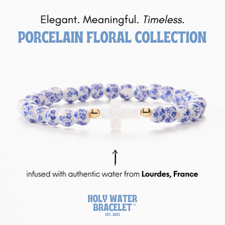 Blue and White Holy Water Porcelain Cross Bracelet with floral porcelain beads and resin cross infused with holy water from Lourdes, France | JSQ Mercantile – Women’s Boutique & Gift Shop in La Grange, IL