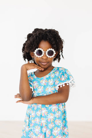 Toddler and young girls daisy sunglasses with floral frames in assorted colors, lightweight and playful design – JSQ Mercantile – a women’s boutique and gift shop in La Grange, IL.