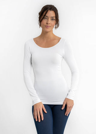 Woman wearing a reversible long sleeve seamless essential top with a flattering stretch fit, styled for everyday wear – JSQ Mercantile – a women’s boutique and gift shop in La Grange, IL.