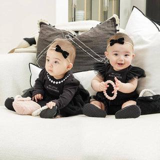 Baby-Girls-playing-with-Plush-Pink-Purse-for-Baby_JSQ-Mercantile_La-Grange,IL