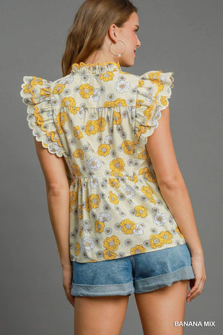Floral print peplum top with scalloped sleeves and lined cotton fabric for women | JSQ Mercantile – a women’s boutique and gift shop in La Grange, IL.