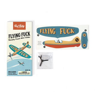 Flying Fuck Foam Mini Glider novelty toy assembled and in packaging – JSQ Mercantile – a women’s boutique and gift shop in La Grange, IL.