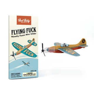 Flying Fuck Foam Mini Glider novelty toy assembled and in packaging – JSQ Mercantile – a women’s boutique and gift shop in La Grange, IL.