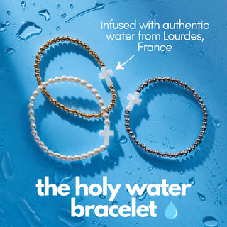 Holy Water Stretch Bracelet with waterproof brass beads and resin cross infused with holy water from Lourdes, France | JSQ Mercantile – Women’s Boutique & Gift Shop in La Grange, IL