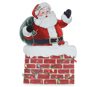 Large wooden Santa Claus porch sitter waving from a chimney with green gift sack | JSQ Mercantile – Women’s Boutique & Gift Shop in La Grange, IL