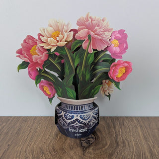 Mini pop-up greeting card with a delicate 3-D pink peony bouquet displayed open on a tabletop, JSQ Mercantile – a women’s boutique and gift shop in La Grange, IL