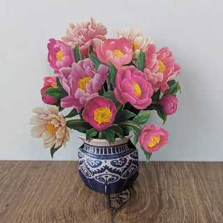 Mini pop-up greeting card with a delicate 3-D pink peony bouquet displayed open on a tabletop, JSQ Mercantile – a women’s boutique and gift shop in La Grange, IL