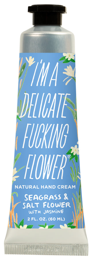 Hand cream tube in seagrass and floral fragrance placed upright on neutral background – JSQ Mercantile, a women’s boutique and gift shop in La Grange, IL