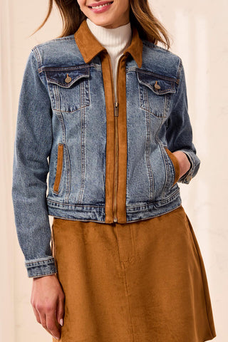 Medium wash denim jacket with suede accents and zip front closure, worn over a white turtleneck.