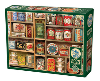 Vintage Tins 1000-piece jigsaw puzzle featuring floral patterned antique tins in a wooden frame, made in the USA from recycled materials | JSQ Mercantile – Women’s Boutique & Gift Shop in La Grange, IL