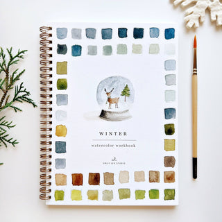 Winter Watercolor Workbook featuring 12 seasonal illustrations with spiral binding and step-by-step painting guides